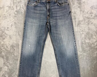 Jeansy męskie Levi's 569 Loose Straight Jeans w kolorze niebieskim, z przetarciami, rozmiar 36x32