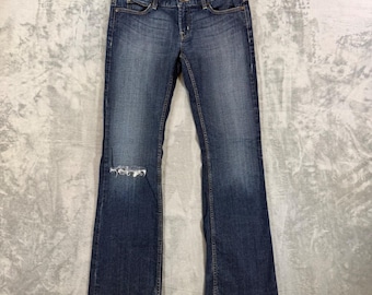 Jeans Guess Foxy Flare Vintage para mujer, talla 30, color azul, efecto desgastado, tiro bajo.