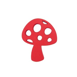 Puede incluir: Corte de hongo de madera rojo con lunares blancos.