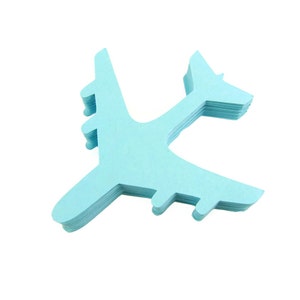 May include: A blue paper airplane cutout, made of multiple layers of paper, is isolated on a white background.