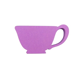 May include: A purple paper teacup cutout. This is a craft supply for scrapbooking, card making, or other paper crafts.