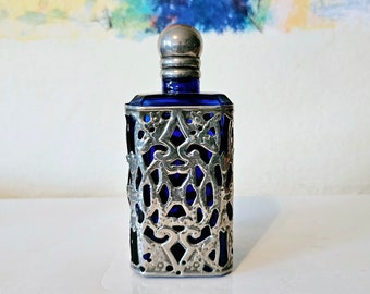 Vintage Art Nouveau style cobalt blue glass perfume bottle.