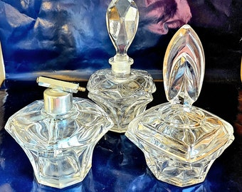 Set of 3 vintage clear thick glass perfume bottles.
