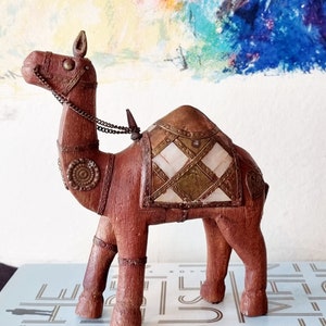 Vintage carved wood camel figurine.