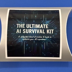 May include: A silver-colored gift box with a white label. The label reads "THE ULTIMATE AI SURVIVAL KIT" in large, bold letters. Below the title is the text "A delightful blend of wisdom & treats to optimize your AI experience."