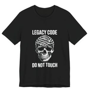 May include: Black t-shirt featuring a white skull graphic with wires and the text "LEGACY CODE" above and "DO NOT TOUCH" below. The shirt has a crew neck design and is made of a soft material.