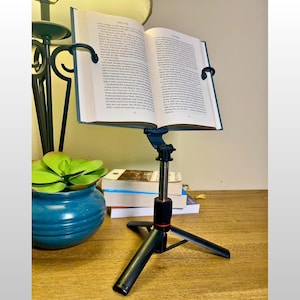 May include: A set of three ceramic mugs with a speckled, matte finish. The mugs are in shades of cream, light gray, and dark gray. Each mug has a simple, minimalist design, perfect for coffee or tea.