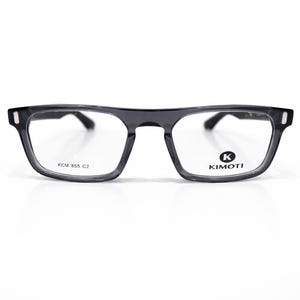 May include: Black rectangular eyeglasses with clear lenses. The frames are a dark gray color. The brand name "KIMOTI" is printed on the right lens. The model number "KCM 855 C2" is printed on the left lens.