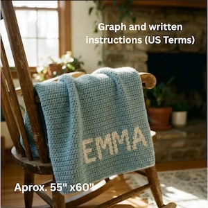 May include: A light blue crocheted blanket with the name "EMMA" in white letters, draped over a wooden rocking chair. The blanket measures approximately 55 x 60 inches. Text on the image reads "Graph and written instructions (US Terms)".