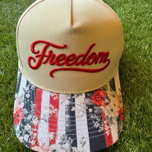 Freedom embroidered patch on red, white and blue flower brim canvas hat