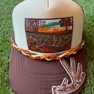 Deer Antler with Sunset embroidered patches on custom trucker hat with coordinating hat chain