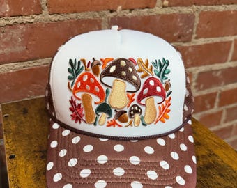 Mushroom embroidered patch on a custom brown polka dot trucker hat