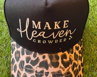 Make Heaven Crowded embroidered trucker hat with leopard brim and cross embroidered detail on side