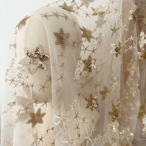 Top quality 3D gold sequin star embroidery lace fabric in champagne tulle for cocktail dress, gowns, bridal veil haute couture costumes