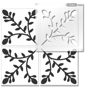May include: A stencil sheet featuring a design of four repeating floral corner motifs. The stencil is made from clear plastic and is intended for use with paint or other mediums.