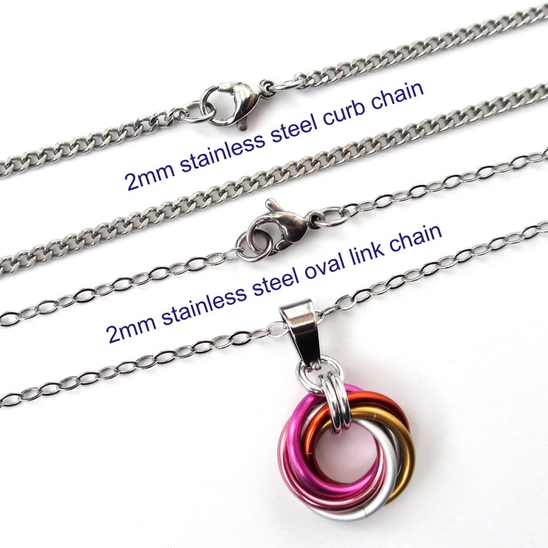 May include: A stainless steel necklace with a pendant of interlocking rings in pink, orange, gold, and silver. The image shows two 2mm stainless steel chains: a curb chain and an oval link chain. Text on the image reads: "2mm stainless steel curb chain" and "2mm stainless steel oval link chain".