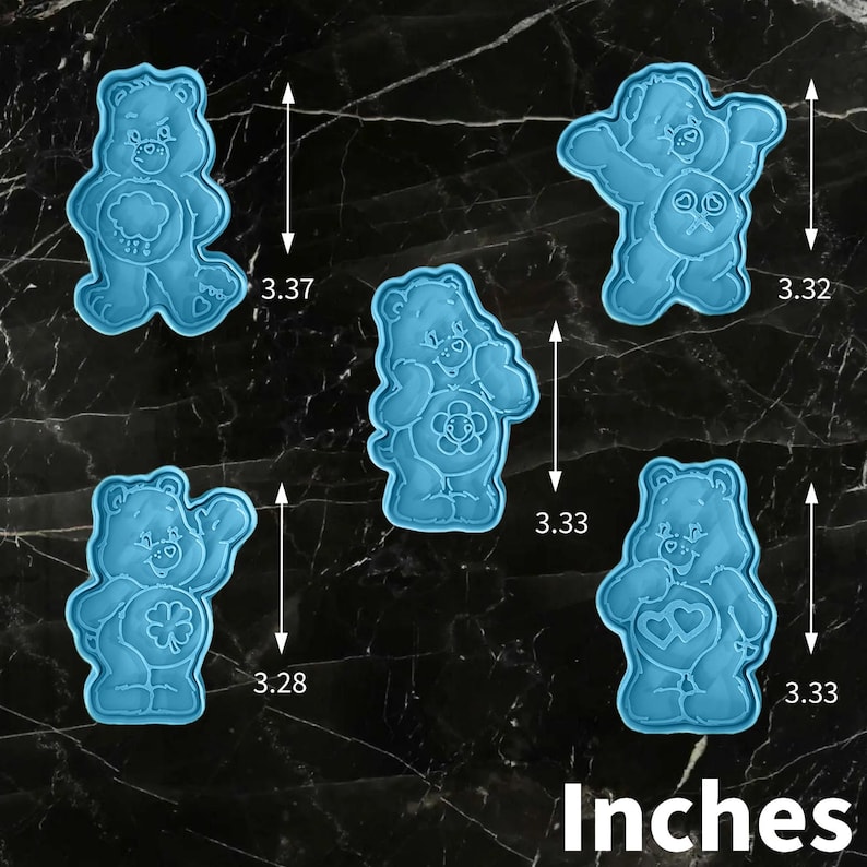 May include: Five blue plastic bear-shaped cookie cutters, each approximately 8.4 cm tall. The bears have different designs on their bellies, including a heart, a shamrock, and a flower. The word "Inches" is printed at the bottom.