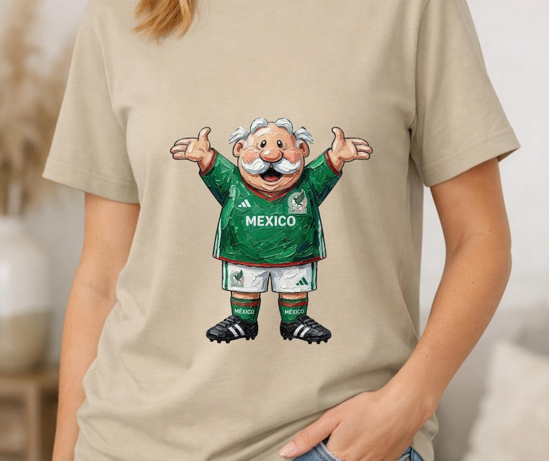 May include: A beige t-shirt featuring a cartoon illustration of an elderly character with a white mustache wearing a green and white Mexico soccer jersey, white shorts, green socks, and black cleats with the text MEXICO printed on the chest.