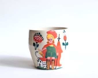 Caneca de cerâmica artesanal: ilustração de pintura em vitral, feita à mão no torno de oleiro.