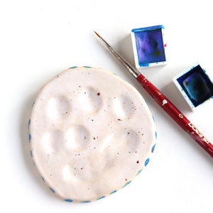 ceramic small paint palette clay beige clay white glossy glaze with spots and blue dots handmade pottery natural rustic travel palette