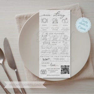 May include: A vertical, grayscale printable card with the words "our story" at the top. The card includes icons and text detailing milestones, activities, and a QR code to share photos. The card is on a white plate with silverware.