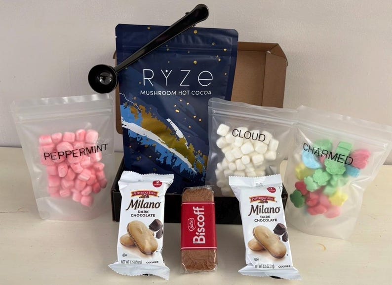 May include: A set of three ceramic mugs with a speckled, matte finish. The mugs are in shades of cream, light gray, and dark gray. Each mug has a simple, minimalist design, perfect for coffee or tea.