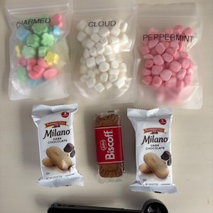 May include: A rustic wooden sign with the text "Welcome to our home" in white lettering. The sign features a distressed finish and a simple, inviting design, perfect for entryway decor.