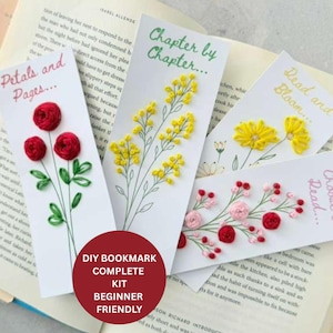 May include: Four handmade bookmarks with embroidered floral designs. One bookmark reads "Petals and Pages..." with red roses. Another says "Chapter by Chapter..." with yellow flowers. The third says "Read and Bloom..." with yellow flowers. The fourth says "Read... Choose..." with pink and red flowers. A red circle reads "DIY BOOKMARK COMPLETE KIT BEGINNER FRIENDLY".