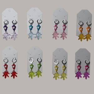 May include: A set of three ceramic mugs with a speckled, matte finish. The mugs are in shades of cream, light gray, and dark gray. Each mug has a simple, minimalist design, perfect for coffee or tea.