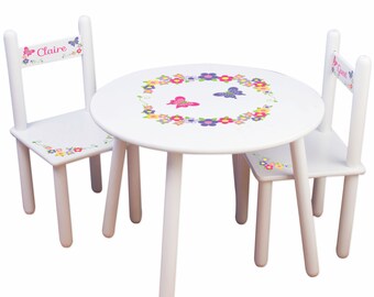 white wooden childrens table and chairs