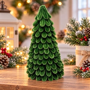 May include: A conical decorative tree crafted from layered green pipe cleaners, featuring a dense, textured surface of looped, fuzzy bristles that mimic the appearance of pine needles in a structured, repeating pattern from base to top.