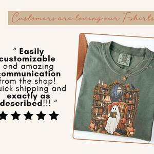 May include: A sage green t-shirt featuring a graphic of a ghost sitting in an armchair reading a book within a library setting filled with bookshelves, pumpkins, and candles. The text reads: Customers are loving our T-shirts and Easily customizable and amazing communication from the shop! Quick shipping and exactly as described!!! with five black stars.