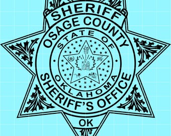 May include: Black and white Osage County Sheriff's Office badge. The badge is star-shaped with the words "SHERIFF OSAGE COUNTY STATE OF OKLAHOMA SHERIFF'S OFFICE OK" in a circular pattern. The center features a star with an emblem.