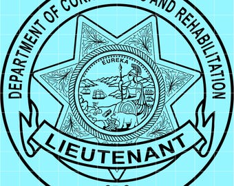 May include: A black and white Department of Corrections and Rehabilitation Lieutenant badge. The badge features a star shape with the text "DEPARTMENT OF CORRECTIONS AND REHABILITATION" around the perimeter. The word "LIEUTENANT" is displayed on a banner, and "CRC" is at the bottom.