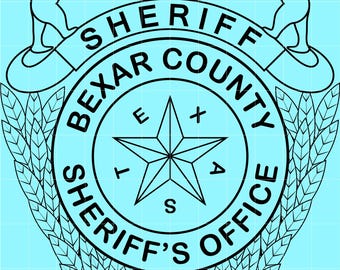 May include: Black and white graphic of the Bexar County Sheriff's Office seal. The seal features a star, text, and a building design, with two bear figures at the top. The background is light blue.