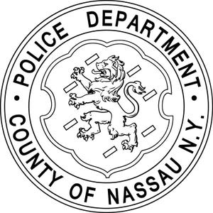May include: A circular black and white emblem featuring a central shield with a rampant lion. The text POLICE DEPARTMENT is arched across the top, and COUNTY OF NASSAU N.Y. is arched across the bottom, separated by two small black dots.