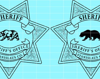 May include: Two sheriff badges with a star shape and a light blue background. Each badge features a bear silhouette, the word "SHERIFF" on a banner, and "SHERIFF'S OFFICE STANISLAUS CO." on a ribbon.