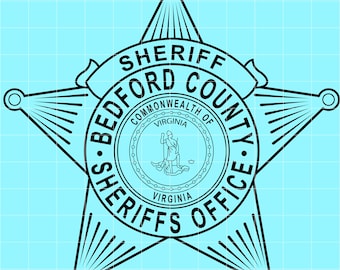 May include: Black and white Bedford County Sheriff's Office badge. The badge is a five-pointed star shape with the words "SHERIFF BEDFORD COUNTY" on a banner. The center circle reads "COMMONWEALTH OF VIRGINIA" and features a figure.