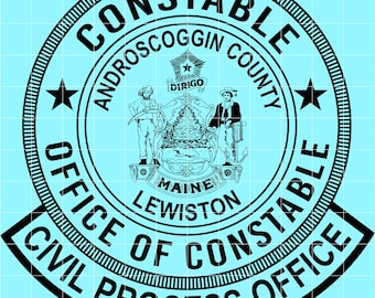 May include: A black and white circular emblem with the words "Constable Office Civil Process Office" and "Androscoggin County" encircling a central design. The design includes two figures, a tree, and the word "Maine".