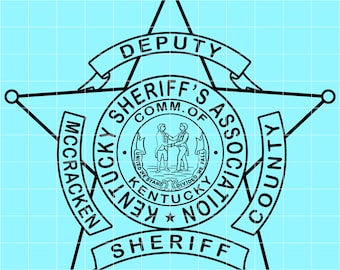 May include: Black and white sheriff's badge with a star shape. The badge features the words "DEPUTY", "SHERIFF'S ASSOC", "MCCRACKEN COUNTY", and "SHERIFF". The center circle depicts two figures shaking hands, with the words "UNITED WE STAND, DIVIDED WE FALL".