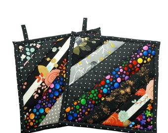 Juego de agarraderas acolchadas, patchwork, estampados negros, 8,5" x 8,5"