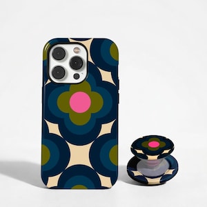 May include: A navy blue phone case and matching phone grip with a retro floral pattern in shades of blue, green, pink, and cream. The phone case is designed to fit a smartphone, and the grip is a pop-out style.