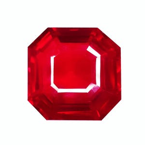 May include: A vibrant, deep red gemstone cut into an octagonal shape with multiple facets. The stone exhibits a high level of clarity and transparency, reflecting light across its polished surfaces to create bright white highlights and deep red tones.