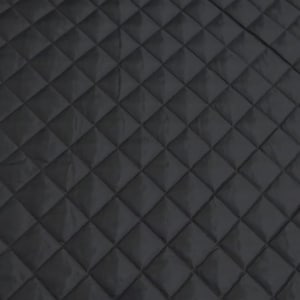 May include: A close-up shot of a black quilted fabric with a diamond pattern. The fabric has a smooth, matte finish and appears to be made of a soft material. The diamond shapes are evenly spaced and create a textured surface.