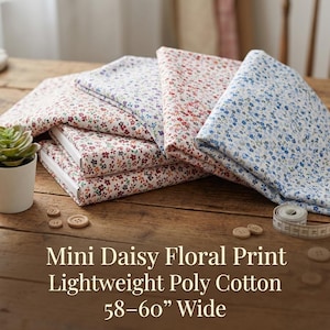 May include: A stack of folded fabric with a mini daisy floral print in various colors, including red, blue, and purple. The fabric is lightweight poly cotton and is 58-60 inches wide. Wooden buttons and a measuring tape are also visible.