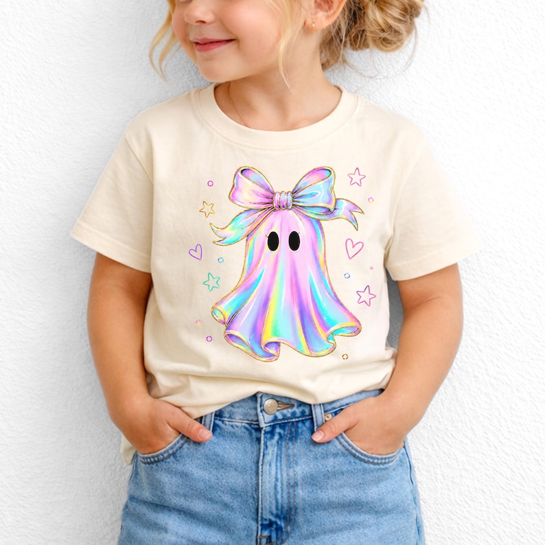 Cute holographic pastel ghost with a bow surrounded by stars and hearts, trendy toddler girls halloween shirt design.