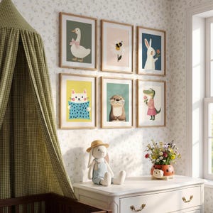May include: A nursery scene featuring framed animal art prints, including a goose, bee, rabbit, cat, otter, and alligator. A stuffed bunny sits on a white dresser, and a canopy bed is visible. A vase of flowers adds a touch of color.
