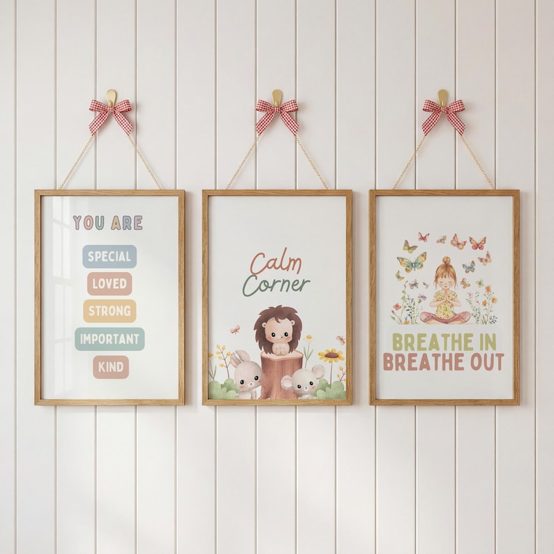 May include: Three framed art prints with positive messages and illustrations. One print reads "You Are" with encouraging words. Another says "Calm Corner" with animal characters. The third print shows a girl meditating with butterflies and the text "Breathe In Breathe Out".