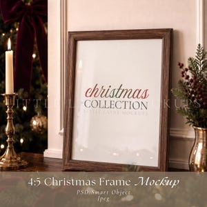 May include: A vertical rectangular picture frame with a dark brown wood grain finish. The frame contains a white insert with the red and green text "christmas COLLECTION" and the smaller gray text "LITTLE LAYNE MOCKUPS" centered.