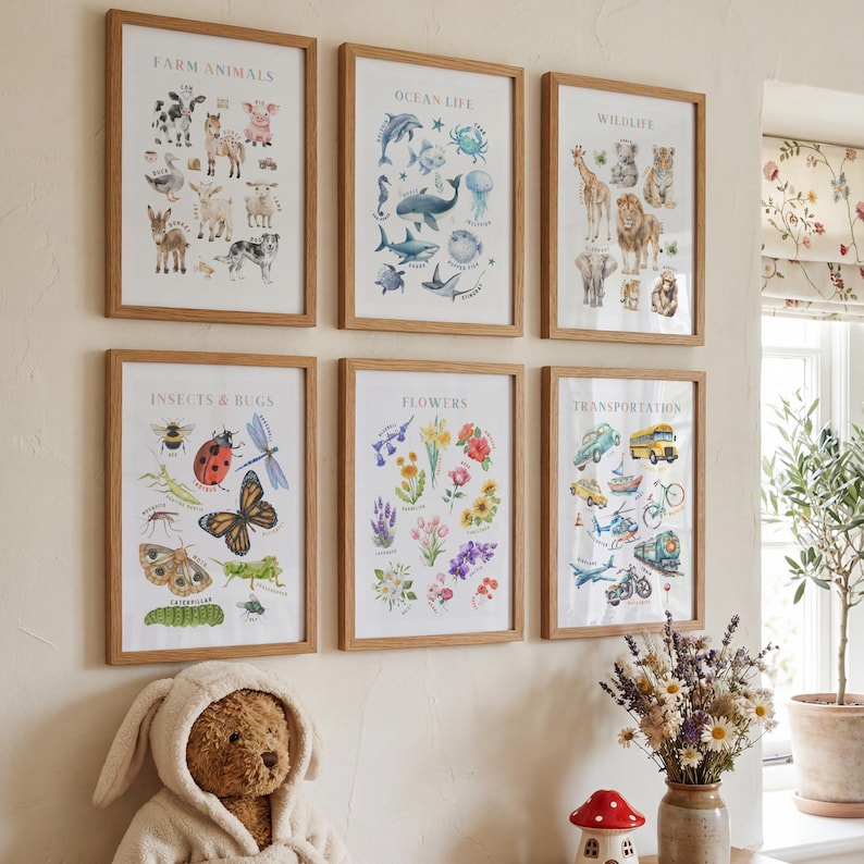 May include: Six framed educational posters with wooden frames are displayed on a wall. The posters feature illustrations of farm animals, ocean life, wildlife, insects and bugs, flowers, and transportation. The posters are in a child's room.